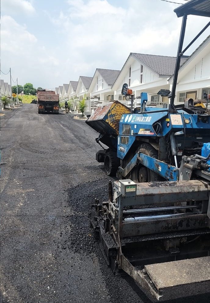 Premix paving in progress between terrace houses at Parkland Chin Chin, Jasin